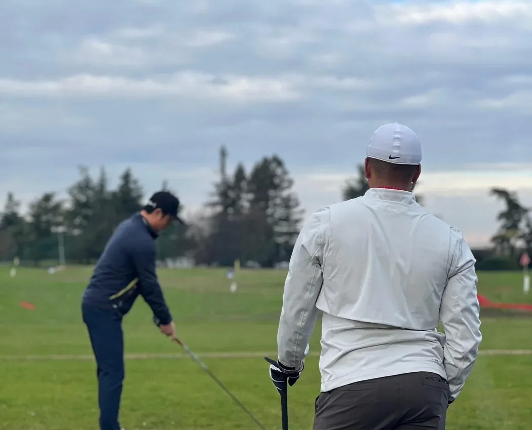 Andy coaching a client on the course